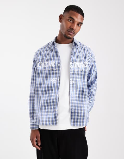 ASOS DESIGN – Blå, rutig skjorta i oversize med tryck på bröstet - view 1