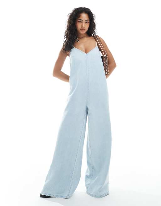 ASOS DESIGN – Blå, tvättad jumpsuit i mjuk denim med djup halsringning och vida ben