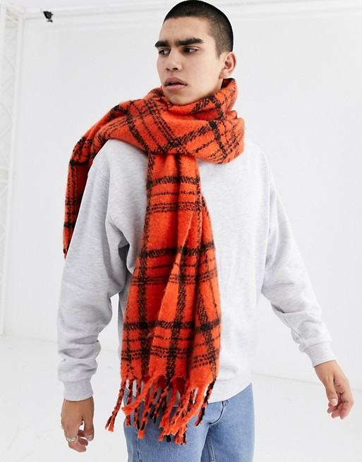 ASOS DESIGN blanket scarf in orange and black brushed check with tassels
