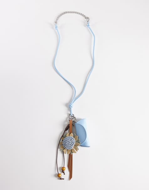 ASOS DESIGN – Blått halsband med blomma och läppstiftsfodral med berlocker - view 1