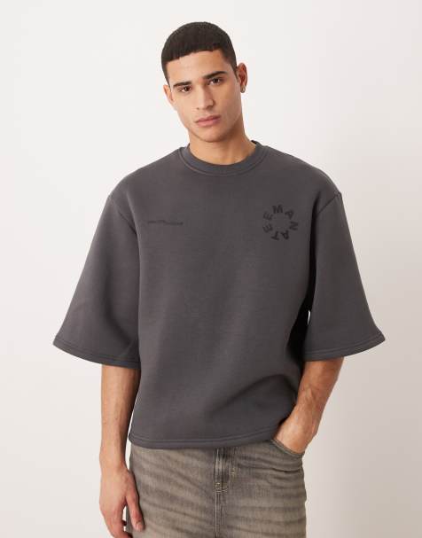 ASOS DESIGN – Bleksvart, avslappnad sweatshirt med korta ärmar och tryck - view 1