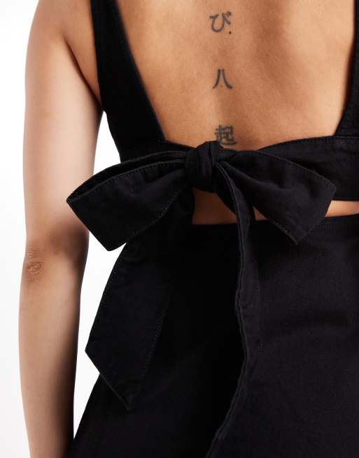 ASOS DESIGN – Bleksvart jeanstopp i peplum-modell med rosett, 3 av 4