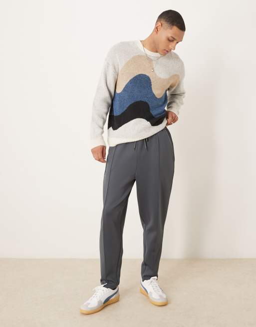 ASOS DESIGN – Bleksvarta, avsmalnande mjukisbyxor i scubamaterial med stråveck