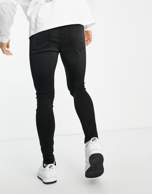 ASOS DESIGN – Bleksvarta spray on-jeans med powerstretch, knärevor och slitna detaljer, 2 av 4