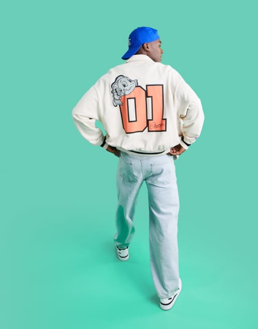 ASOS DESIGN - Blouson Harrington oversize en jersey à imprimés universitaires placés multicolores - Beige