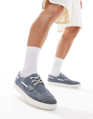 boat shoes in blue chambray with white sole