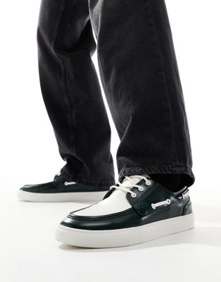  boat shoes in green and white faux leather