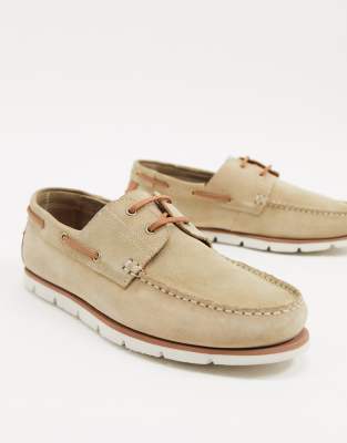 white sole boat shoes