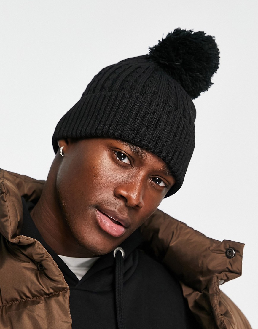 ASOS DESIGN bobble beanie with cable knit design in black