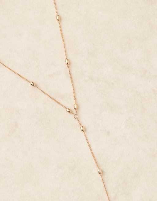ASOS DESIGN body harness with dot dash in gold tone