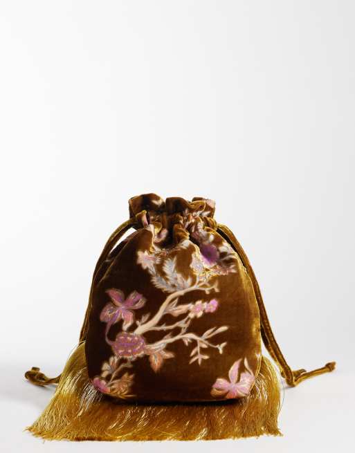 ASOS DESIGN bolso tipo pouch de terciopelo devoré en mostaza, 1 de 4