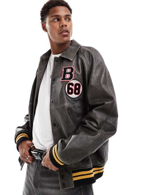 ASOS DESIGN - Bomberjack van echt leer met varsity badges in zwarte wassing