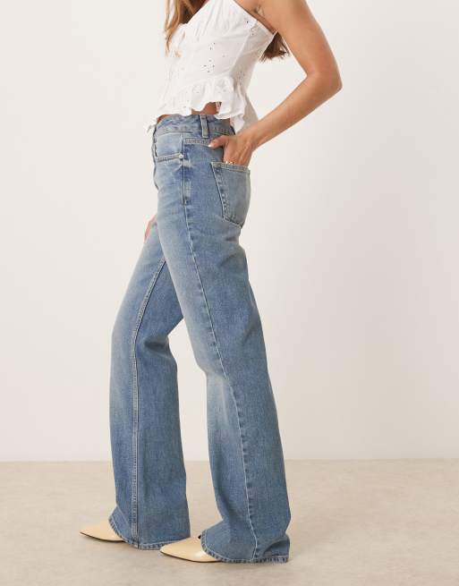 ASOS DESIGN bootcut jeans in mid wash blue , 2 of 5