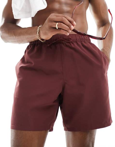 ASOS DESIGN swim shorts in mid length in burgundy
