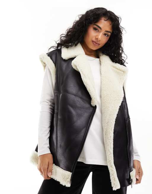 ASOS DESIGN borg faux fur vest in black with contrast borg detail