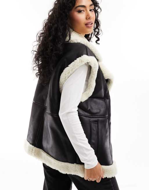 ASOS DESIGN borg faux fur vest in black with contrast borg detail