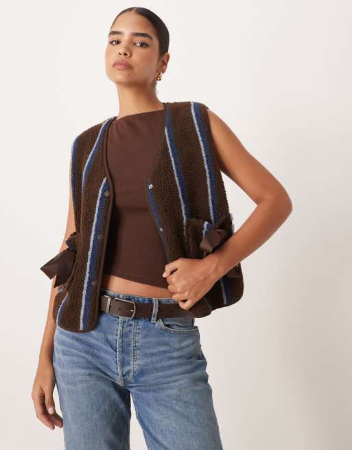 ASOS DESIGN borg fleece gilet in with bow pocket detail in blue and chocolate stripe