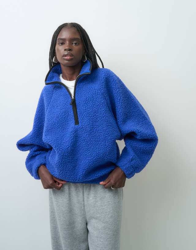 ASOS DESIGN borg half zip with contrast binding in blue and black