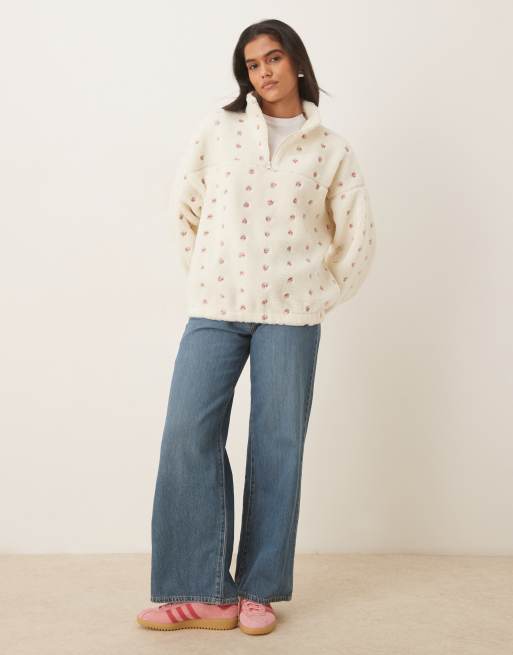 ASOS DESIGN borg zip through fleece with embroidered flower detail in cream