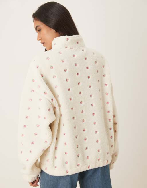 ASOS DESIGN borg zip through fleece with embroidered flower detail in cream