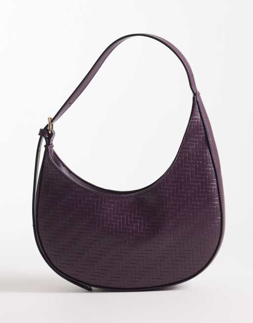 ASOS DESIGN - Borsa da spalla arrotondata asimmetrica color bordeaux intrecciata con fibbie