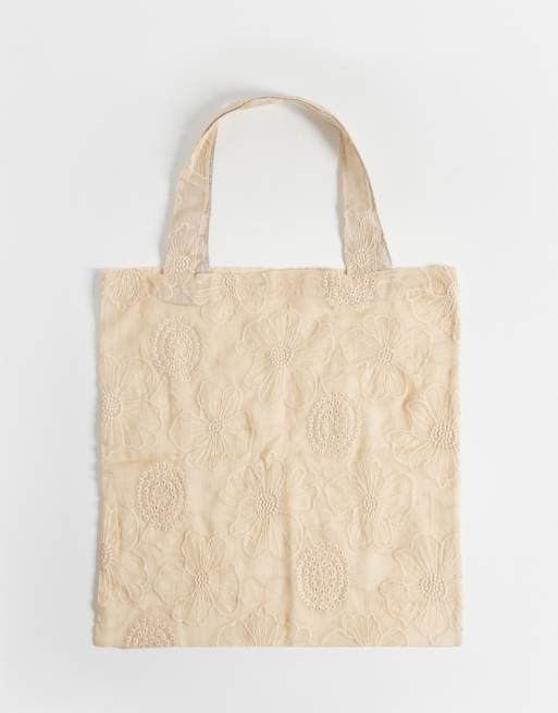ASOS DESIGN - Borsa shopping color pietra trasparente con fiori ricamati