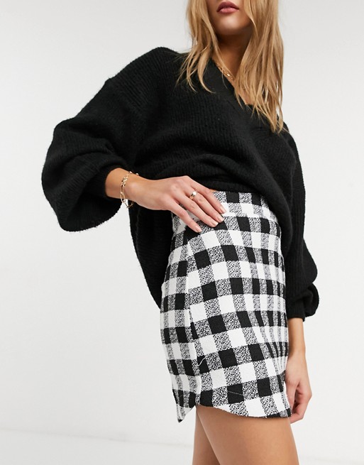 ASOS DESIGN boucle mini skirt with curved hem in mono check print