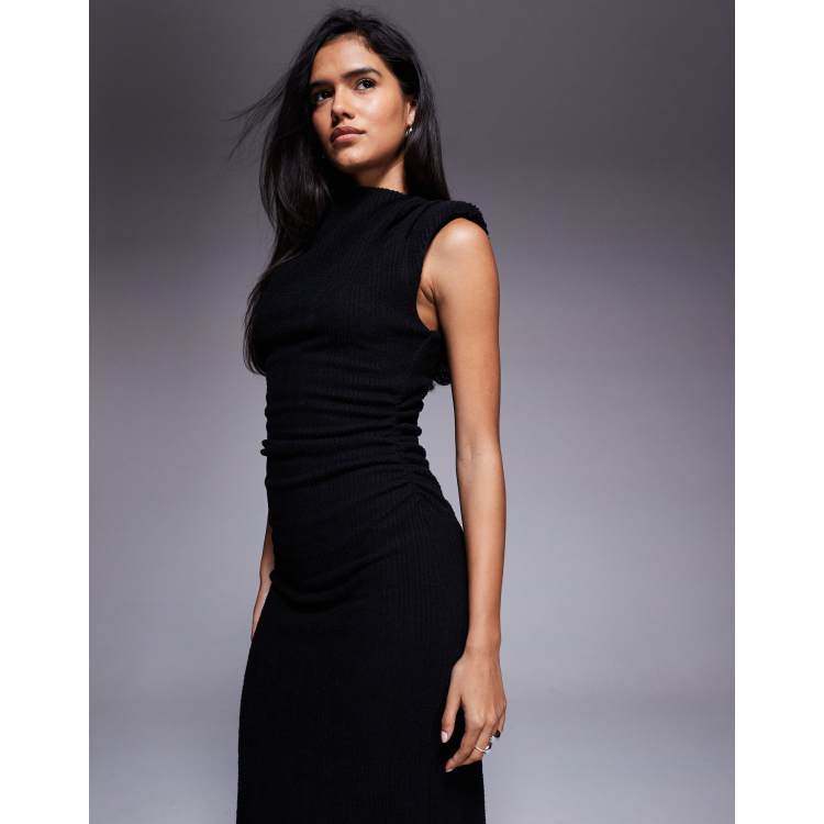 black dress with shoulder pads Norma Kamali Dresses it creates a strong and sculpted silhouette Im not sure if this