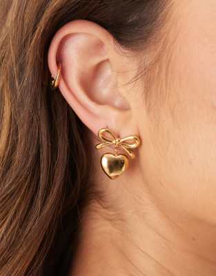 ASOS DESIGN - Boucles d'oreilles en acier inoxydable résistant à l'eau avec détail cœur et nœud - Doré | ASOS