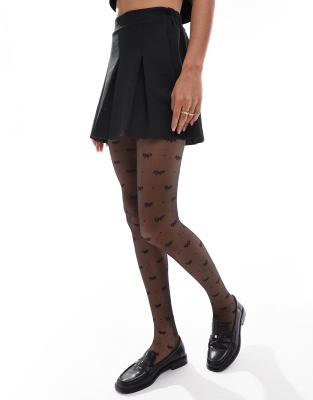 bow and dot tights in black