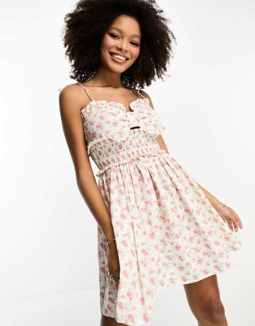 ASOS DESIGN bow bust shirred waist mini sundress in pink ditsy print