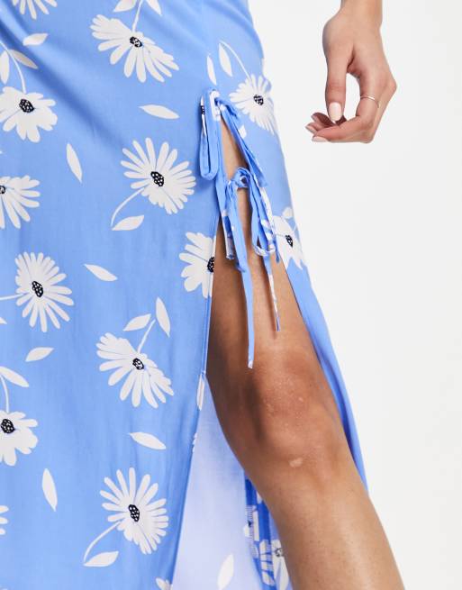 ASOS DESIGN bow detail midi skirt with thigh split in blue daisy print