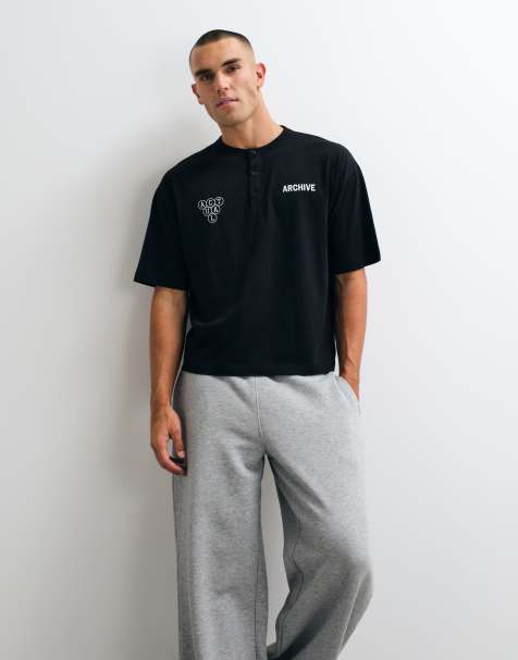 ASOS DESIGN boxig oversize henley-t-shirt med texttryck i svart - view 1