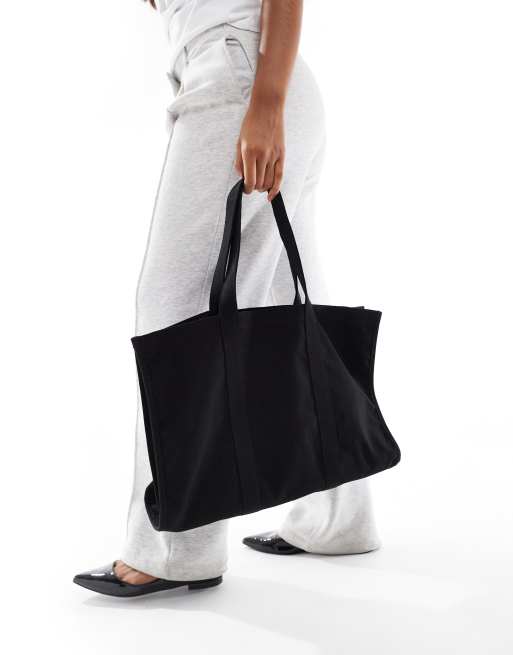 ASOS DESIGN boxy canvas laptop tote bag in black