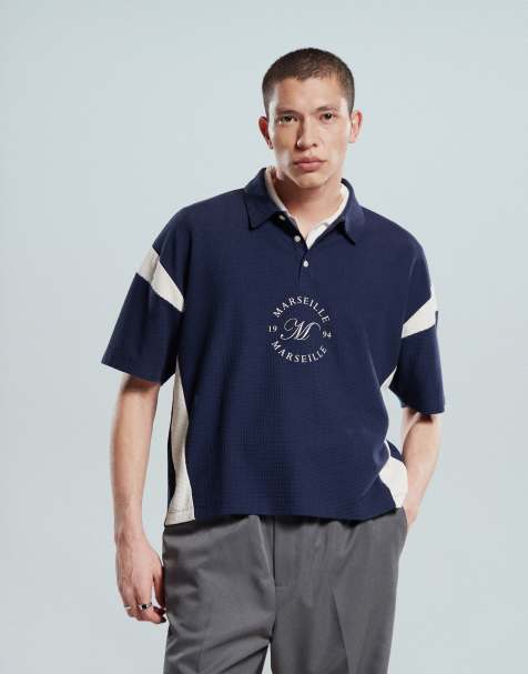 ASOS DESIGN boxy heavyweight 230gsm waffle texture oversized polo with paneling and chest print in navy - view 1