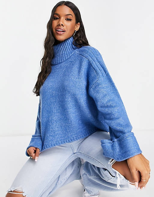 Women boxy jumper with high neck and turn back cuff in blue 