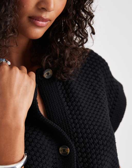 ASOS DESIGN boxy knit stitch vest with button detail in black