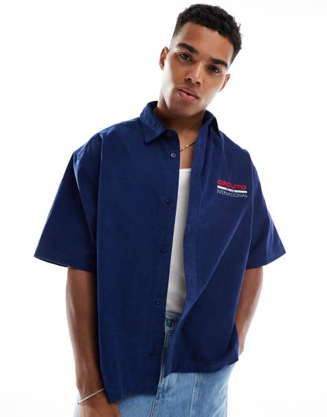 ASOS DESIGN boxy oversized cord shirt with chest print in navy - view 1