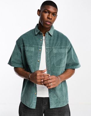 ASOS DESIGN boxy oversized cord shirt with double pockets in blue wash