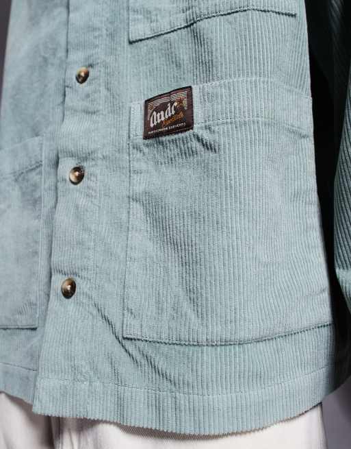 ASOS DESIGN boxy oversized corduroy shirt with badge detail in green