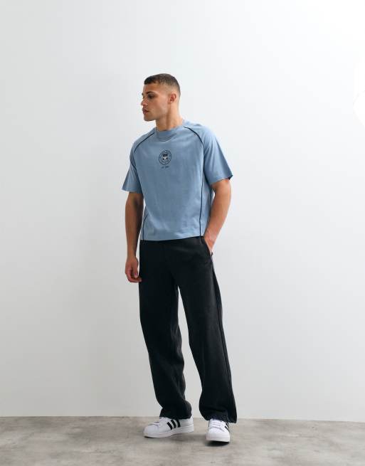 ASOS DESIGN boxy oversized cut and sew t-shirt with sports graphic in blue, 2 of 5