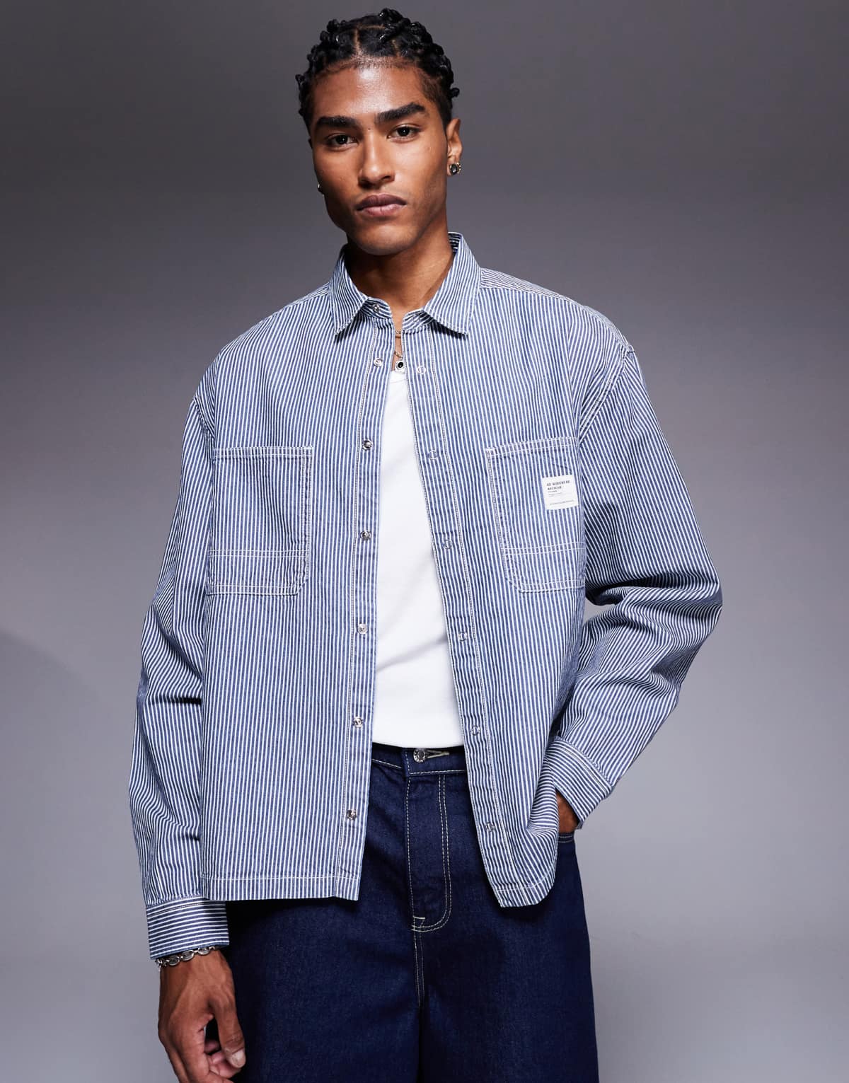 ASOS DESIGN boxy oversized denim shirt with badge in navy stripe