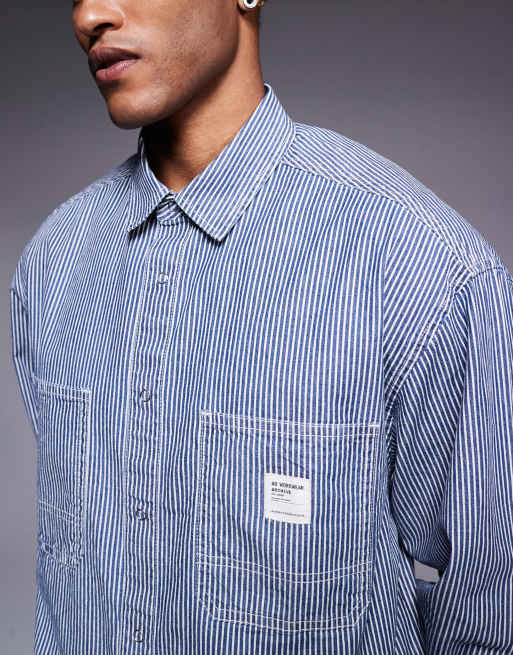 ASOS DESIGN boxy oversized denim shirt with badge in navy stripe