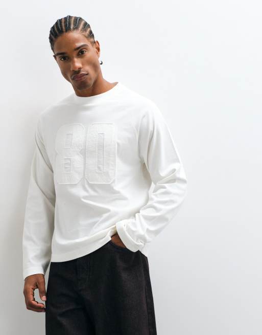 ASOS DESIGN boxy oversized long sleeve raglan t-shirt with 80 varsity print in cream, 2 of 5