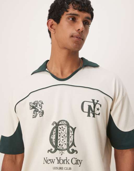 ASOS DESIGN boxy oversized polo shirt with cut and sew paneling and city graphics in cream