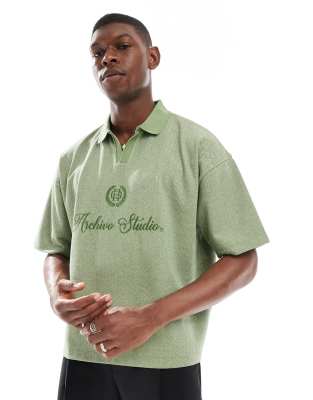boxy oversized polo with chest embroidery in green chevron fabric