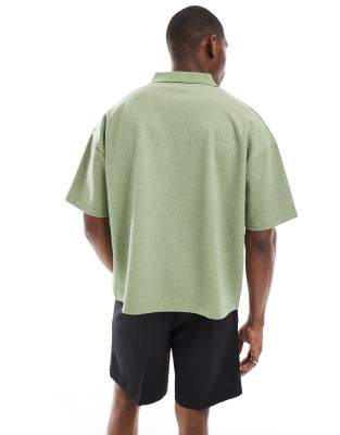 ASOS DESIGN boxy oversized polo with chest embroidery in green chevron fabric