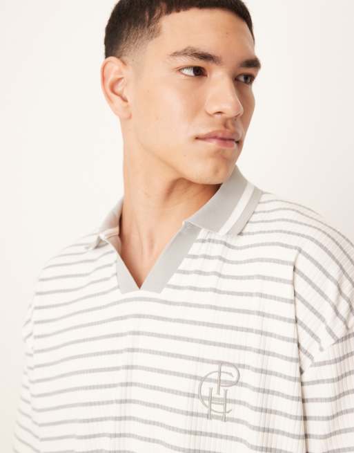 ASOS DESIGN boxy oversized polo with chest logo in blue and white ribbed stripe
