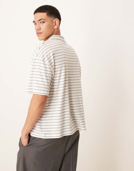ASOS DESIGN boxy oversized polo with chest logo in blue and white ribbed stripe