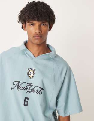 Asos Design Boxy Oversized Polo With Sports Graphic In Blue